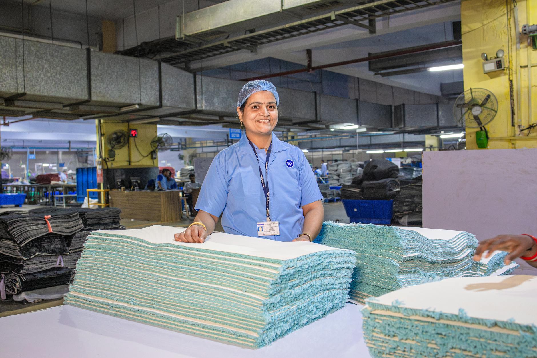 smiling factory worker in textile industry setting
