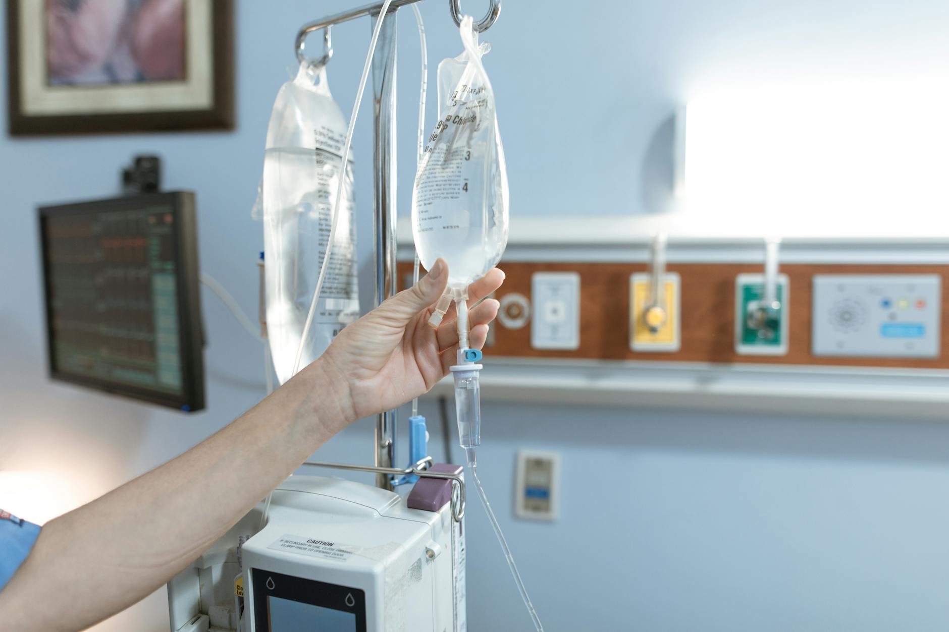 person monitoring a dextrose