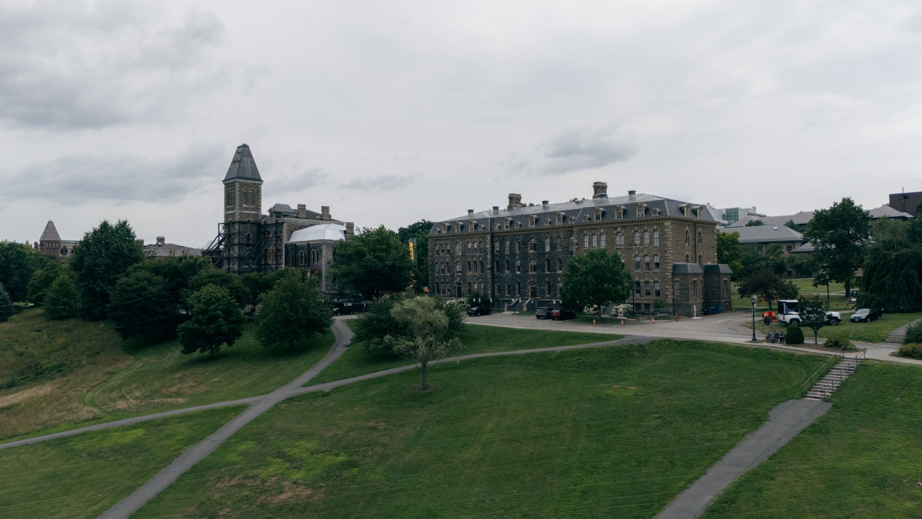historic campus building with scenic greenery